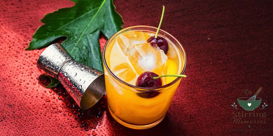 Summertime Orange Drink with Ice and Cherries